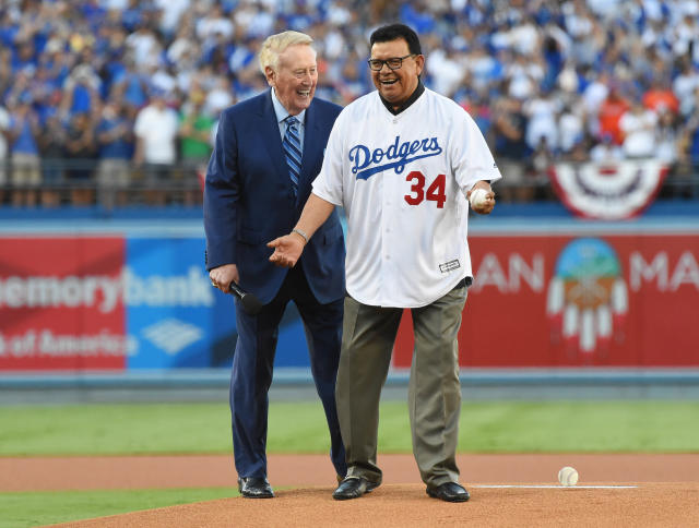 Retired Major League Baseball pitcher Fernando Valenzuela throws the  inaugural ball during the regular-season major league baseball game between  the San Diego Padres and the Los Angeles Dodgers in …