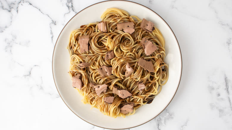 chocolate spaghetti with broken toaster pastries on plate