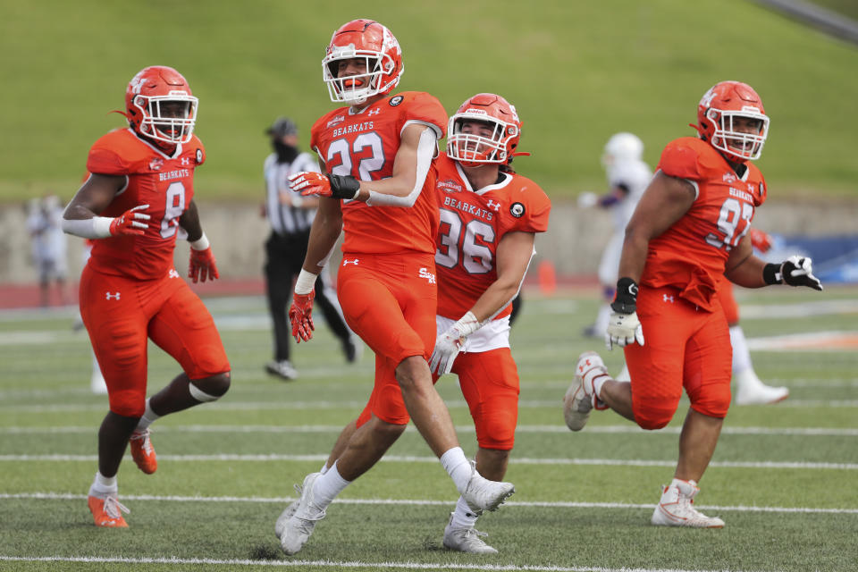 Sam Houston State defensive back Zyon McCollum (22) celebrates after intercepting a pass during the fourth quarterof a semifinal game in the NCAA college football FCS playoffs against James Madison, Saturday, May 8, 2021, in Huntsville, Texas. Sam Houston came from behind to edge James Madison 38-35, for a berth in the FCS national championship game. (Brett Coomer/Houston Chronicle via AP)