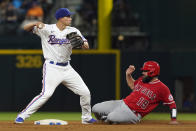 Los Angeles Angels Austin Romine (19) slides into second base on the force out as Texas Rangers shortstop Corey Seager holds the throw to first base during the fourth inning of a baseball game in Arlington, Texas, Monday, May 16, 2022. Angels Taylor Ward was safe at first base. (AP Photo/LM Otero)