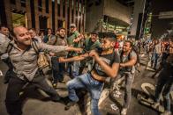 <p>Members act against the incumbent president, Michel Temer, exchanged punches with impeachment supporters of Dilma Rousseff on Tuesday in Sao Paulo, Brazil on August 30, 2016. (Cris Faga/NurPhoto via Getty Images) </p>