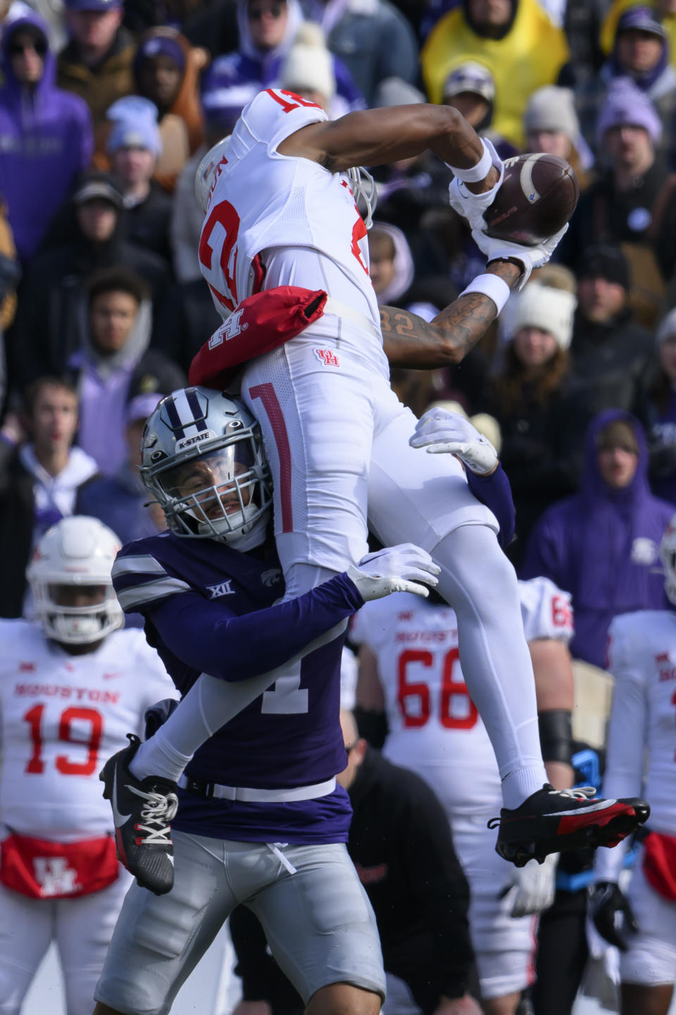 Kansas State cornerback Keenan Garber (1) tackles Houston wide receiver Stephon Johnson (12) as he makes a catch during the second half of an NCAA college football game in Manhattan, Kan., Saturday, Oct. 28, 2023. (AP Photo/Reed Hoffmann)