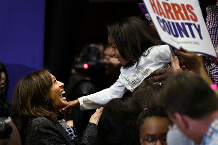 U.S. 2020 Democratic presidential candidate Kamala Harris greets a young supporter at the end of a rally at Texas Southern University in Houston, Texas, U.S., March 23, 2019. REUTERS/Loren Elliott