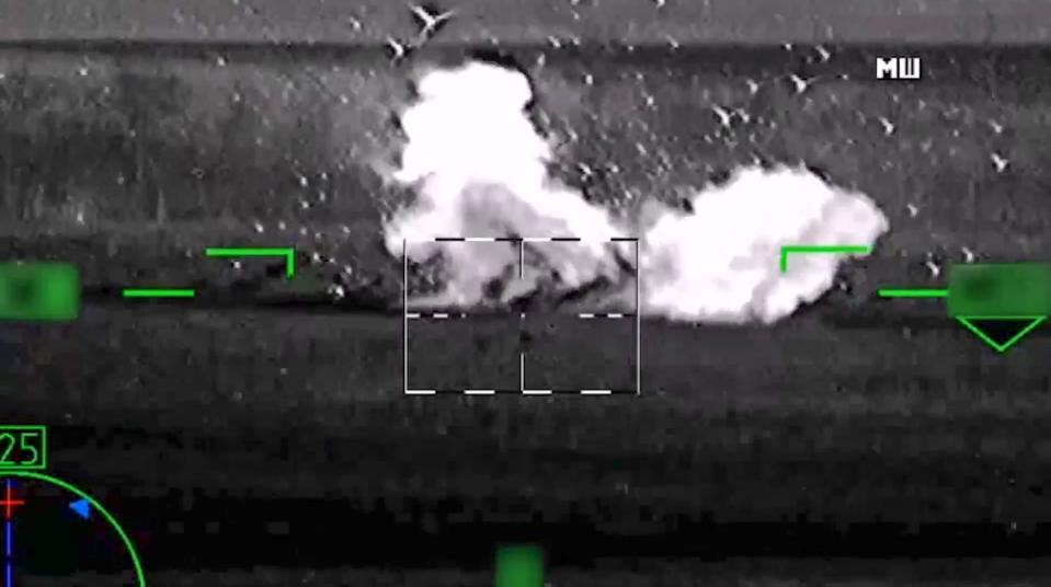 In this image from video, released by the Russian Defense Ministry Press Service on June 6, 2023, shows what Russia claimed was the destruction of a German-made Leopard tank. But a visual analysis by The Associated Press shows the grainy black-and-white video Russia released prove it had blown up the tanks actually documented the destruction of a tractor. Two experts, who watched the Russian video, both said the vehicle struck by the helicopter's missile was not a Leopard tank, or any other type of armored vehicle. Valentin Châtelet, a research associate at The Atlantic Council's Digital Forensic Research Lab, also said the objects in the video were clearly not Leopard tanks.(Russian Defense Ministry Press Service via AP)