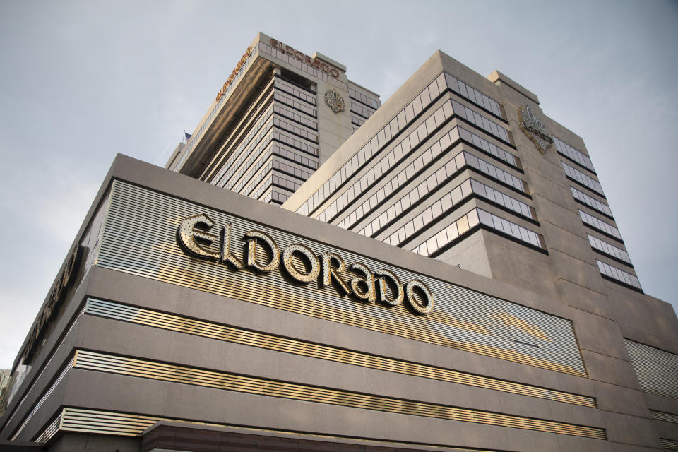 FILE - In this June 24, 2019, file photo, the Eldorado Resort Casino stands in Reno, Nev. Reno-based Eldorado Resorts Inc. received the go-ahead from Nevada casino regulators to buy Caesars Entertainment Corp. in a $17 billion deal creating a gambling giant with properties in 16 U.S. states and several other countries. The merger won unanimous endorsement Wednesday, July 8, 2020, after pointed questions from Nevada Gaming Control Board regulators and unanimous approval from the state Gaming Commission. Approval in coming days from regulators in Indiana and New Jersey would create the world's largest casino company under the Caesars Entertainment name. (Colton Lochhead/Las Vegas Review-Journal via AP, File)