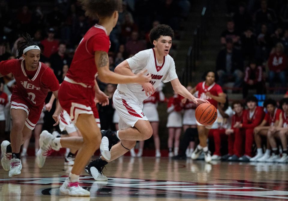 Harrison’s Malachi McNair (44) dribbles as the Harrison Warriors play the Jeffersonville Red Devils during the 2024 IHSAA Class 3A Boys Basketball Regional at Memorial Gym in Huntingburg, Ind., Saturday, March 9, 2024.