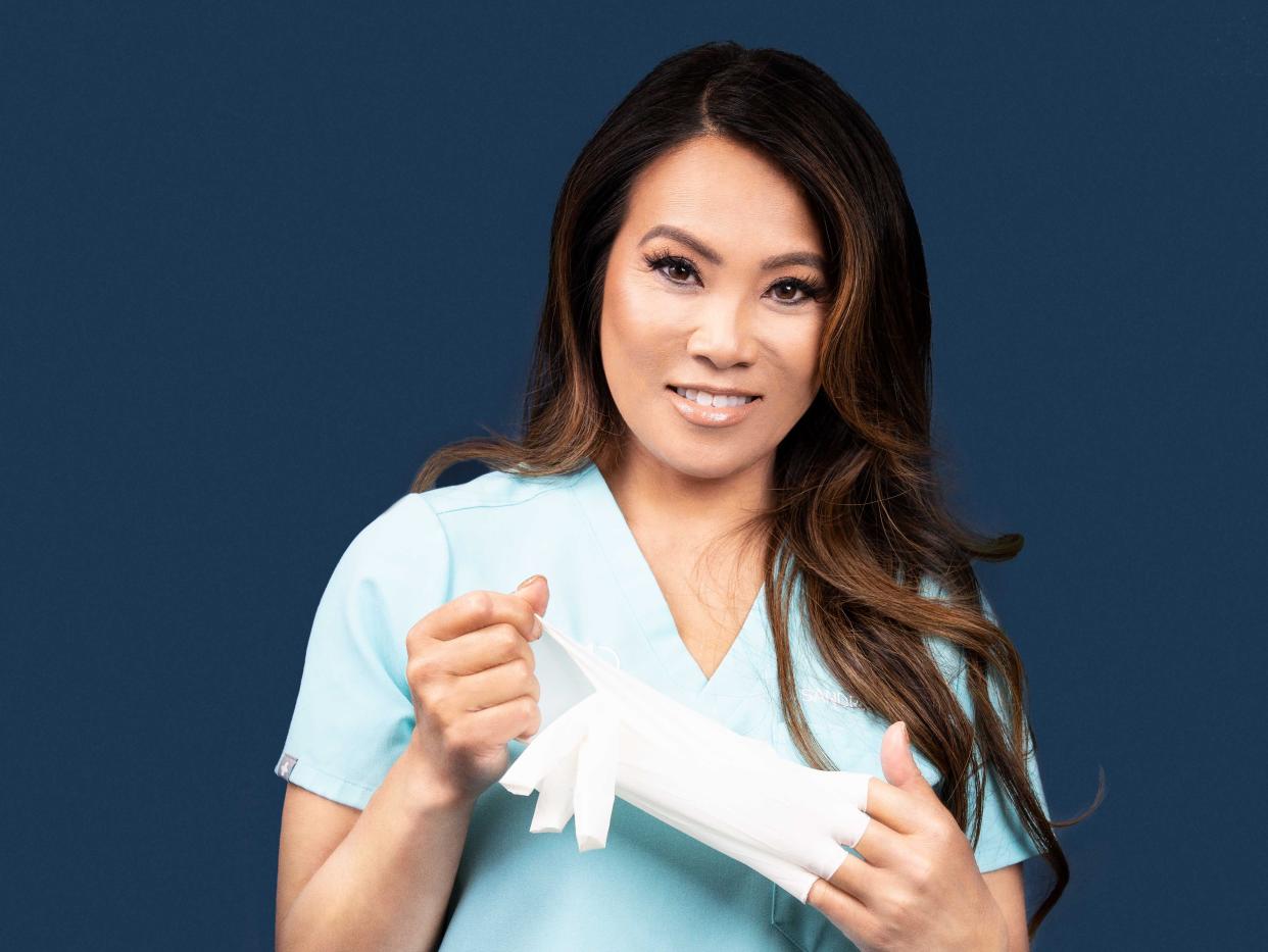 Dr Sandra Lee in scrubs.