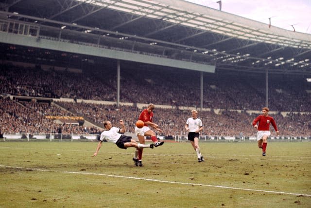 Roger Hunt, centre, in action against West Germany in the 1966 World Cup final