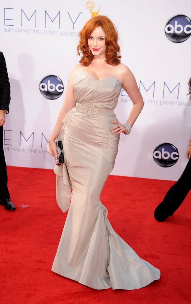 "Mad Men's" Christina Hendricks donned a strapless gold dress by Christian Siriano that hugged her curves – but didn’t necessarily complement them. "I just thought it looked like Old Hollywood glamour," the redheaded actress told Ryan Seacrest about her dress on the red carpet.