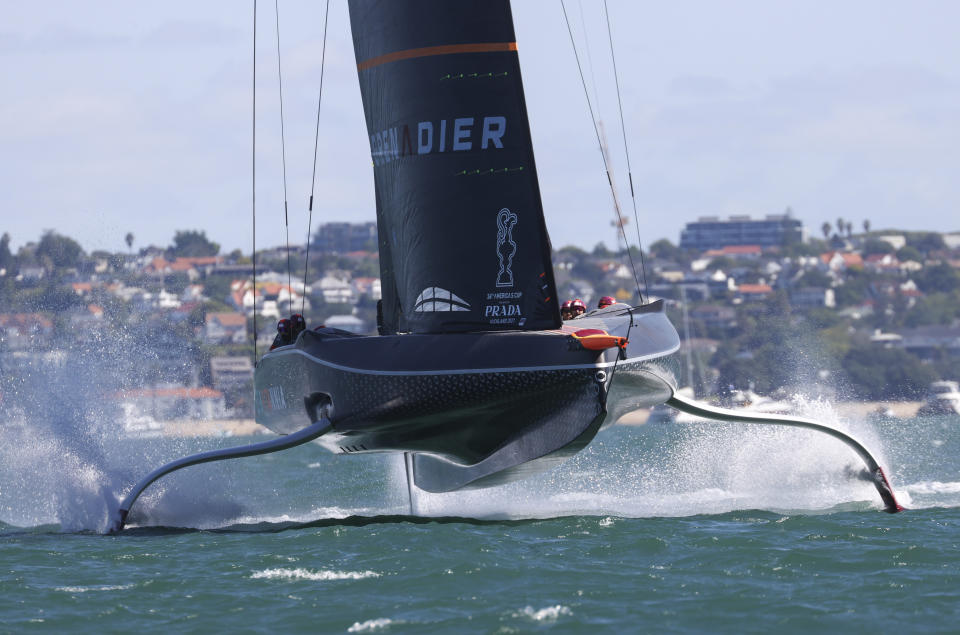 Ineos Team UK races Italy's Luna Rossa during the Prada Cup challengers series on Auckland's Waitemate Harbour, New Zealand, Friday, Jan. 15, 2021. The winner of the five week long Challenger Series goes on to challenge defenders Team New Zealand for the America's Cup from March 6 to 15. (Brett Phibbs/NZ Herald via AP)