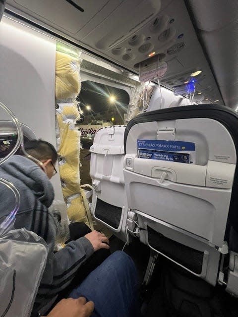 The view from Huy Tran's seat on Alaska Airlines Flight 1282, headed from Portland, Oregon, to Ontario, California, on Jan. 5, 2024. The Boeing 737 Max 9 jet lost a door-sized panel of its fuselage just after takeoff.