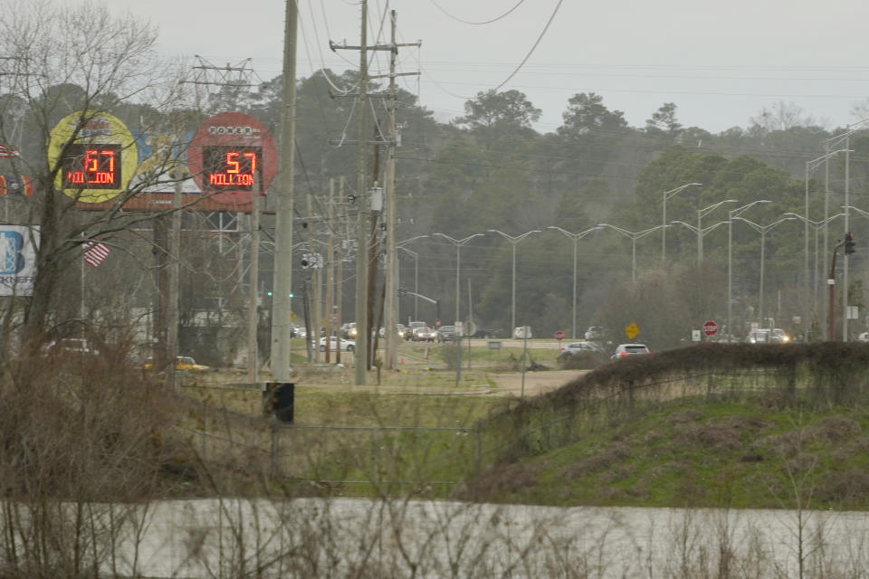 Traffic from Jackson, Miss., crosses over the Pearl River, one of the proposed boundaries for the enlarged Capital Complex Improvement District, Feb. 14, 2023. A bill being considered by the majority-white Mississippi Legislature would expand the patrol territory for the state-run Capitol Police within the majority-Black city and would create a court system with appointed rather than elected judges. (AP Photo/Rogelio V. Solis)