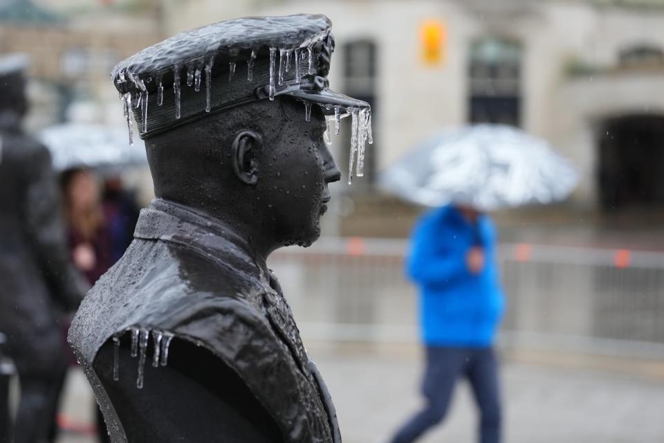 Ice freezes on a statue as freezing rain falls on downtown Ottawa March 23, 2023. (Sean Kilpatrick/The Canadian Press - image credit)