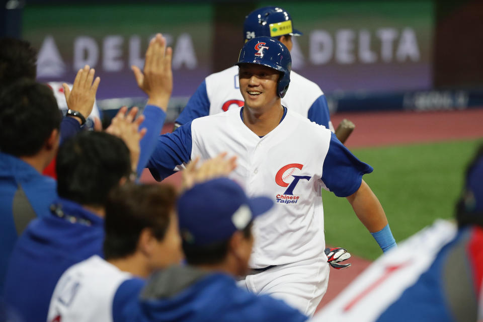 SEOUL, SOUTH KOREA - MARCH 09:  Outfielder Kuo-Hui Kao #28 of Chinese Taipei celebrates with his team mates after scoring a run by a RBI single of Infielder Yung-Chi Chen #13 to make it 8-8 in the bottom of the seventh inning during the World Baseball Classic Pool A Game Six between South Korea and Chinese Taipei at Gocheok Sky Dome on March 9, 2017 in Seoul, South Korea.  (Photo by Chung Sung-Jun/Getty Images)