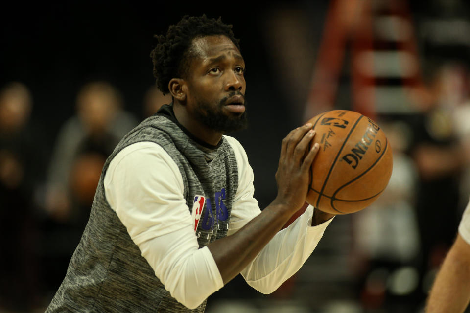 Patrick Beverley with a ball in his hands prepares to shoot during warm-ups.