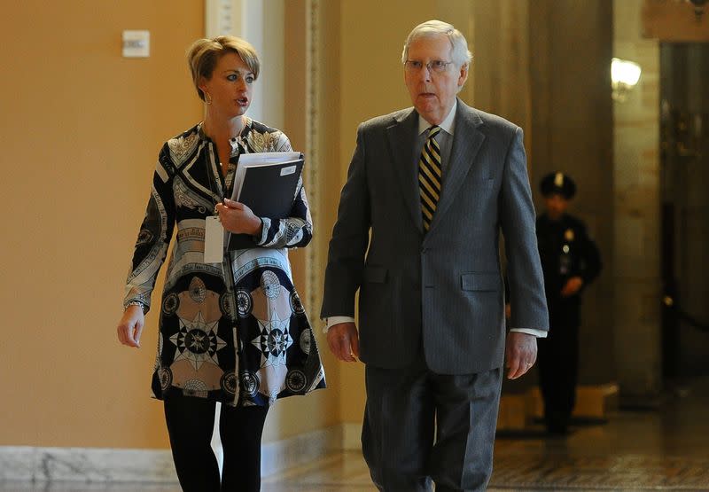 Senate Majority Leader Mitch McConnell walks to the Senate floor before the start of the day's Senate impeachment trial of President Donald Trump in Washington
