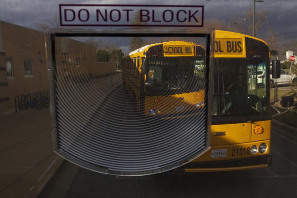 A diesel school bus sits outside Rock Creek Forest Elementary School, Friday, Feb. 2, 2024, in Chevy Chase, Md. (AP Photo/Tom Brenner)