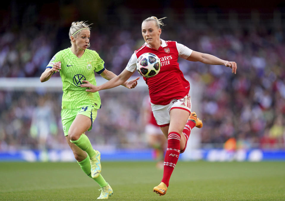 VfL Wolfsburg's Kathrin Hendrich, left, and Arsenal's Stina Blackstenius battle for the ball during the Women's Champions League semifinal second leg soccer match between Arsenal and VfL Wolfsburg at the Emirates Stadium, London, Monday May 1, 2023. (Adam Davy/PA via AP)