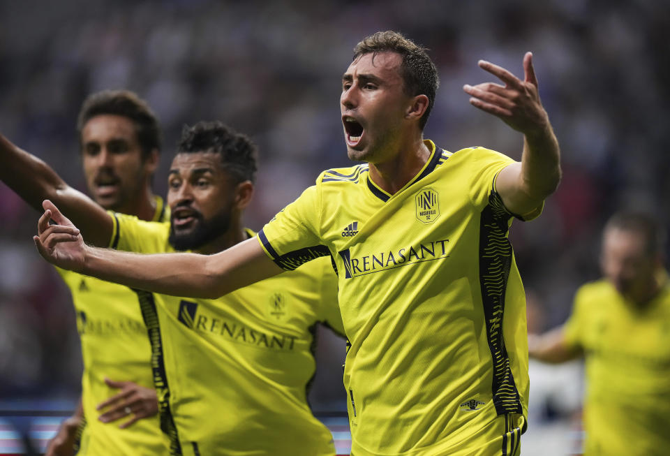 Nashville FC's Jack Maher, front right, celebrates after his goal against the Vancouver Whitecaps during first-half MLS soccer match action in Vancouver, British Columbia, Saturday, Aug. 27, 2022. (Darryl Dyck/The Canadian Press via AP)