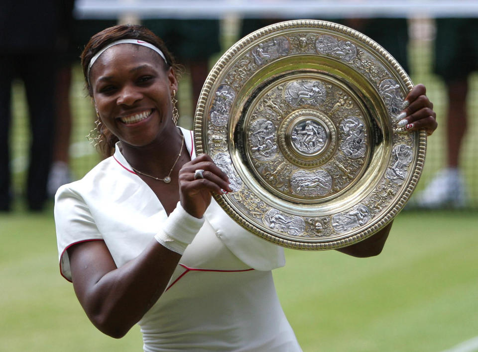 USA's Serena Williams holds up her trophy as she celebrates winning the Ladies Singles Final on Day Twelve of the 2010 Wimbledon Championships at the All England Lawn Tennis Club, Wimbledon. (Photo by Andrew Milligan/PA Images via Getty Images)