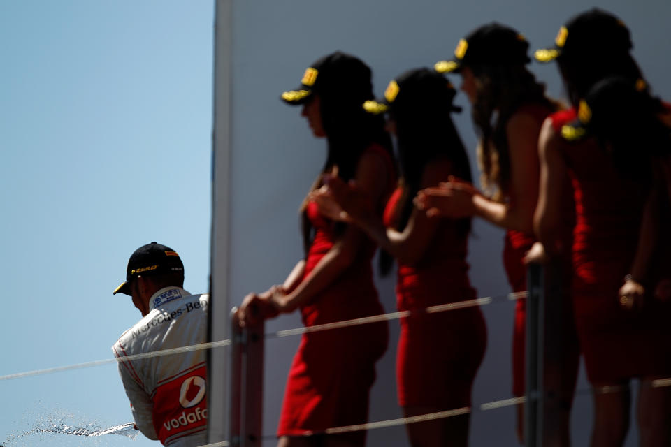 MONTREAL, CANADA - JUNE 10: Lewis Hamilton of Great Britain and McLaren celebrates on the podium after winning the Canadian Formula One Grand Prix at the Circuit Gilles Villeneuve on June 10, 2012 in Montreal, Canada. (Photo by Vladimir Rys/Getty Images)