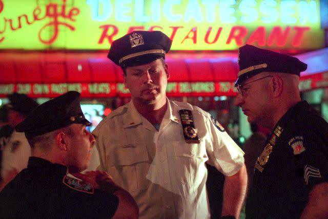 <p>Netflix</p> Cops on the scene at New York's Carnegie Deli in 'Homicide: New York'