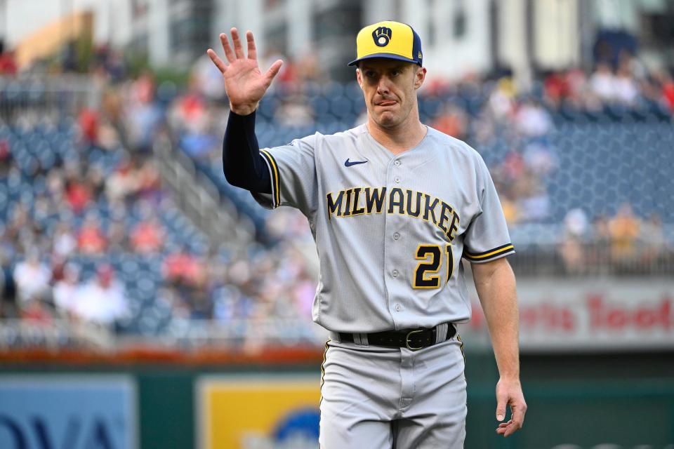 Milwaukee Brewers designated hitter Mark Canha (21) gestures before the game against the Washington Nationals at Nationals Park.