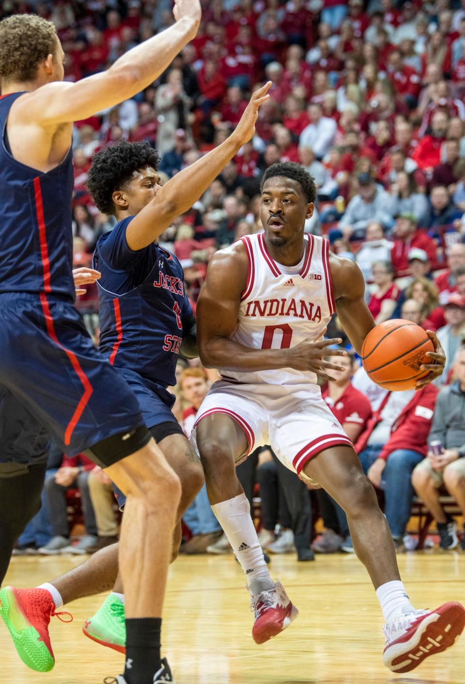 Indiana's Xavier Johnson (0) draws a double team during the first half of the Indiana versus Jackson State men's basketball game at Simon Skjodt Assembly Hall on Friday, Nov. 25, 2022.