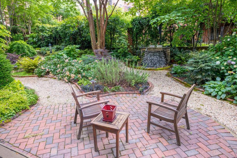 The Rash garden on Pine Street has a recycled-water fountain, pea gravel-lined-paths and a White Crepe Myrtle.