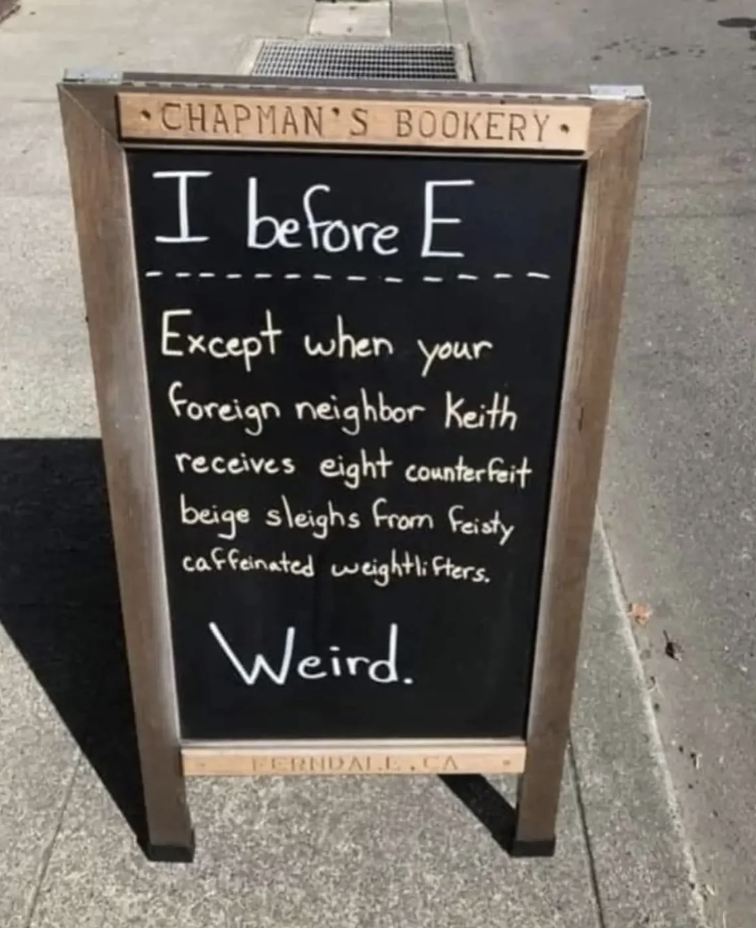 Sign with text "I before E except when your foreign neighbor Keith receives eight counterfeit beige sleighs from feisty caffeinated weightlifters. Weird."