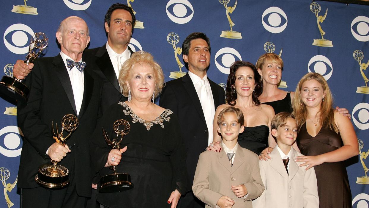 LOS ANGELES, CA - SEPTEMBER 18:  The cast of 'Everybody Loves Raymond', (L-R) Peter Boyle, Brad Garrett, Doris Roberts, Ray Romano, Patricia Heaton, Monica Horan, Sawyer Sweeten, Sullivan Sweeten and Madylin Sweeten pose with the Emmy for Outstanding Comedy Series in the press room at the 57th Annual Emmy Awards held at the Shrine Auditorium on September 18, 2005 in Los Angeles, California.