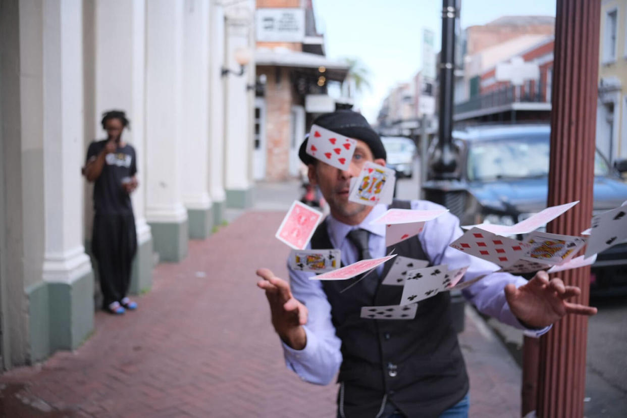 Man throwing playing cards in the air (Alex Seitz-Wald / NBC News)