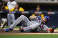 New York Mets' Pete Alonso is on the ground after being hit by a pitch while batting during the second inning of the team's baseball game against the San Diego Padres on Tuesday, June 7, 2022, in San Diego. (AP Photo/Gregory Bull)