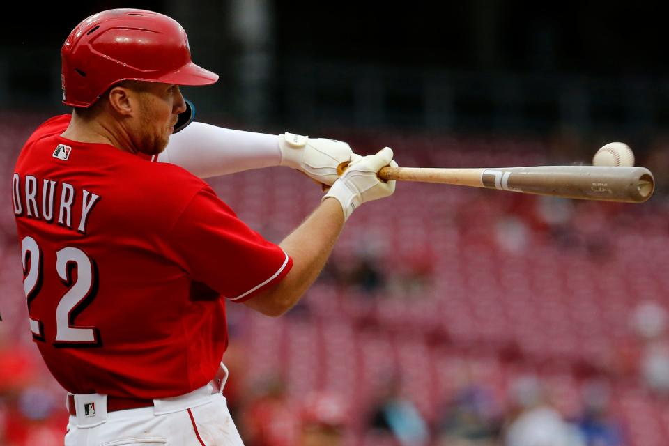 Cincinnati Reds third baseman Brandon Drury (22) hits a two-RBI double in the eighth inning of the MLB National League game between the Cincinnati Reds and the Chicago Cubs at Great American Ball Park in downtown Cincinnati on Thursday, May 26, 2022. Following a 59 minute delay, the Reds won 20-5 in the series finale. 