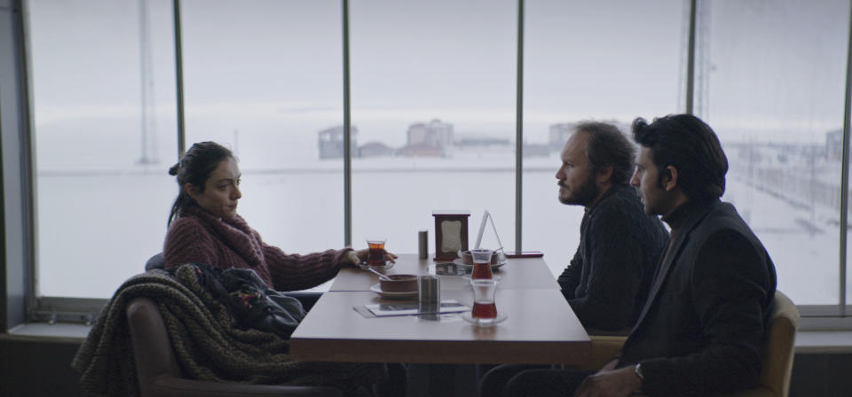 This image released by Janus and Sideshow Films shows, from left, Merve Dizdarin, Deniz Celiloğlu and Musab Ekici in a scene from "About Dry Grasses." (Sideshow and Janus Films via AP)