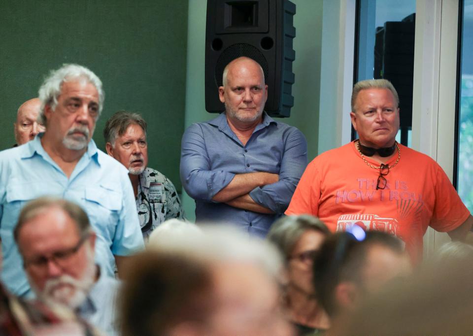 Real estate investor J. Corey Crowley (center) attends a town hall meeting with Martin County Commissioner Sarah Heard to discuss parking proposals and development in Port Salerno on Tuesday, Oct. 3, 2023, at the Port Salerno Civic Center, 4950 S.E. Anchor Ave. Many in attendance were part of the Save Our Salerno (S.O.S.) nonprofit and are opposed to Crowley's vision for Port Salerno.