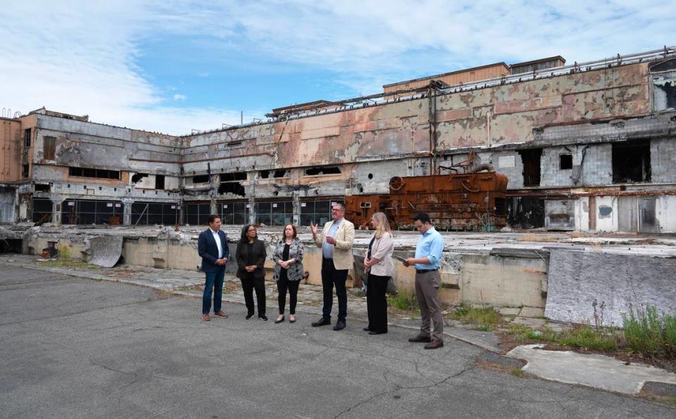 City, regional and national representatives gather at the former Olympia Brewery in Tumwater, Washington, on Friday, June 16, 2023, for the announcement of a $500,000 grant to study the environmental effects of redeveloping the property. From left are EPA regional administrator Casey Sixkiller, U.S. Rep. Marilyn Strickland, Tumwater mayor Debbie Sullivan, outgoing Tumwater city administrator John Dean, incoming Tumwater city administrator Lisa Parks and Tumwater economic development manager Austin Ramirez.