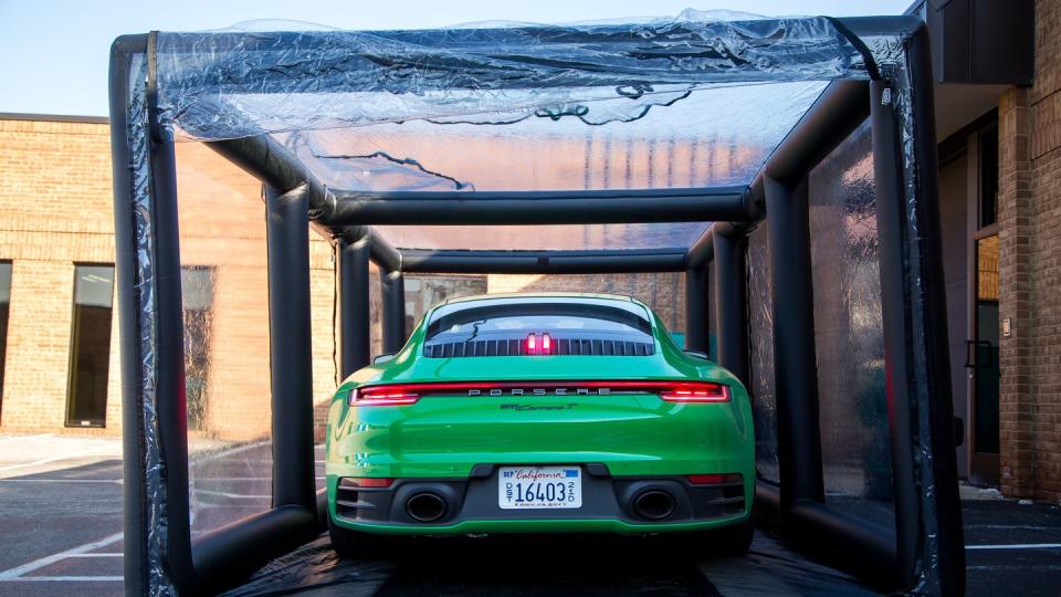 best car covers tested green car porsche in doorway