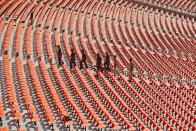 Members of bomb disposal squad from Gujarat Police scan the stands at Sardar Patel Gujarat Stadium event in Ahmedabad