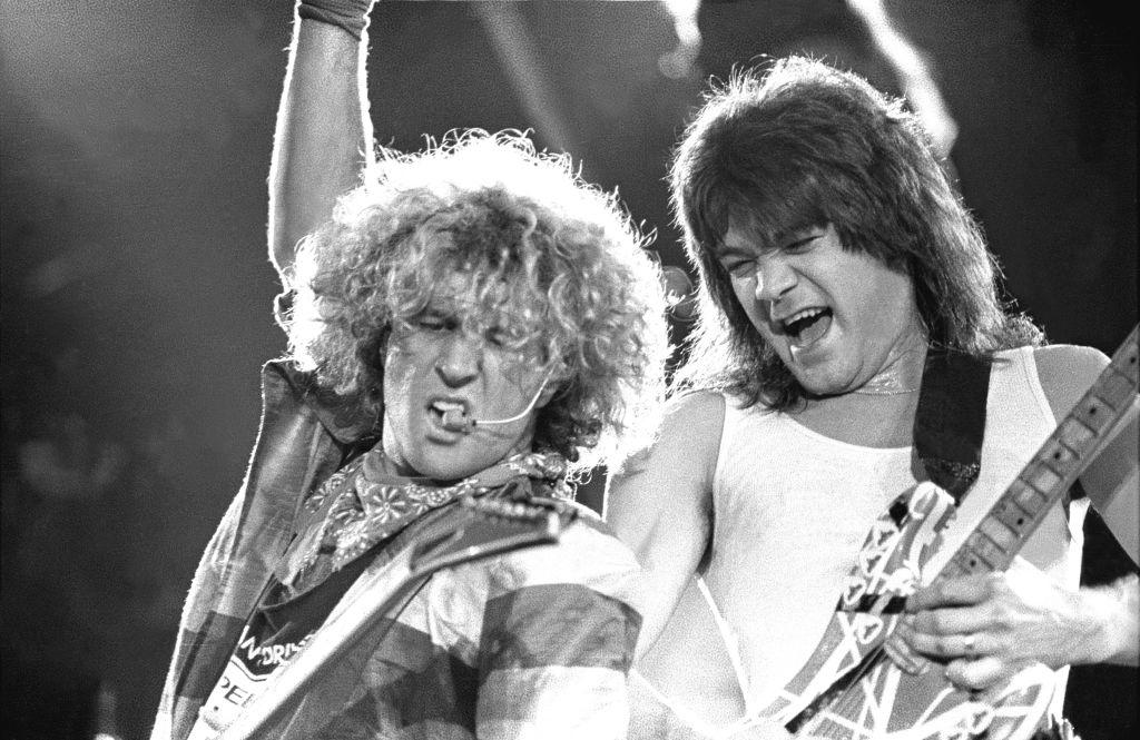  Guitarist Eddie Van Halen and Sammy Hagar are shown performing on stage during a "live" concert appearance with Van Halen on August 26, 1986. (Photo by John Atashian/Getty Images). 