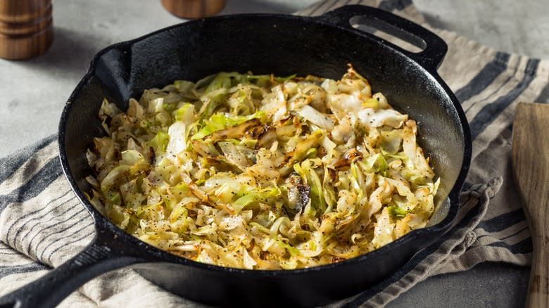 Cooked cabbage in cast iron pan