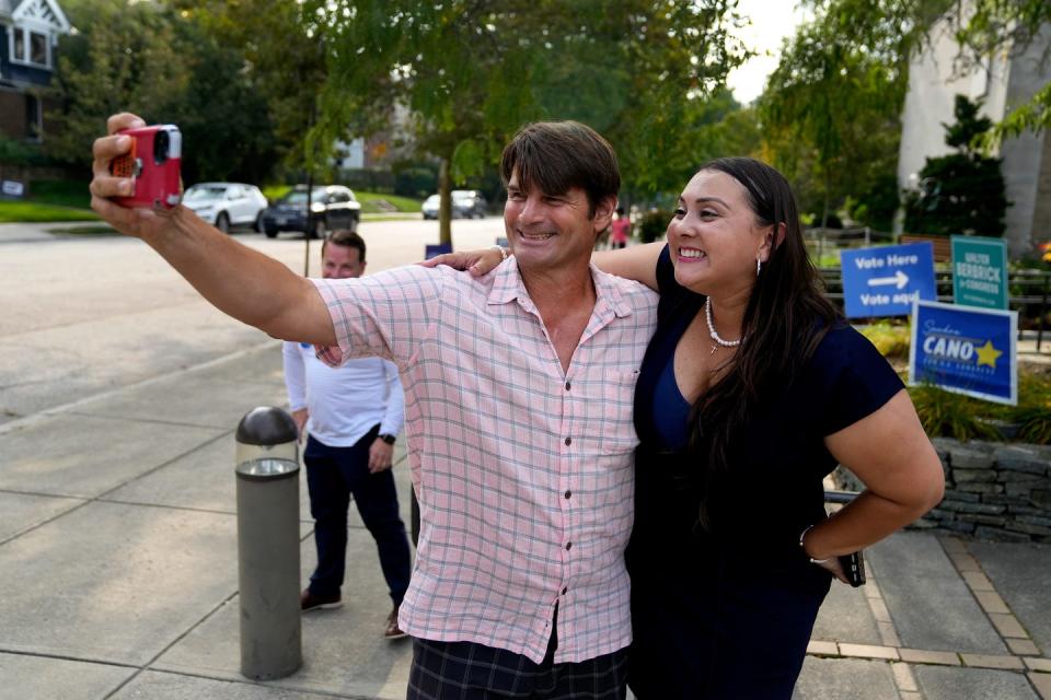 Democratic candidate and state Sen. Sandra Cano poses for a photo with voter Oliver Dow, who was heading into Temple Beth-el in Providence to cast his vote in the special election Democratic primary in Rhode Island's Congressional District 1 on Tuesday.