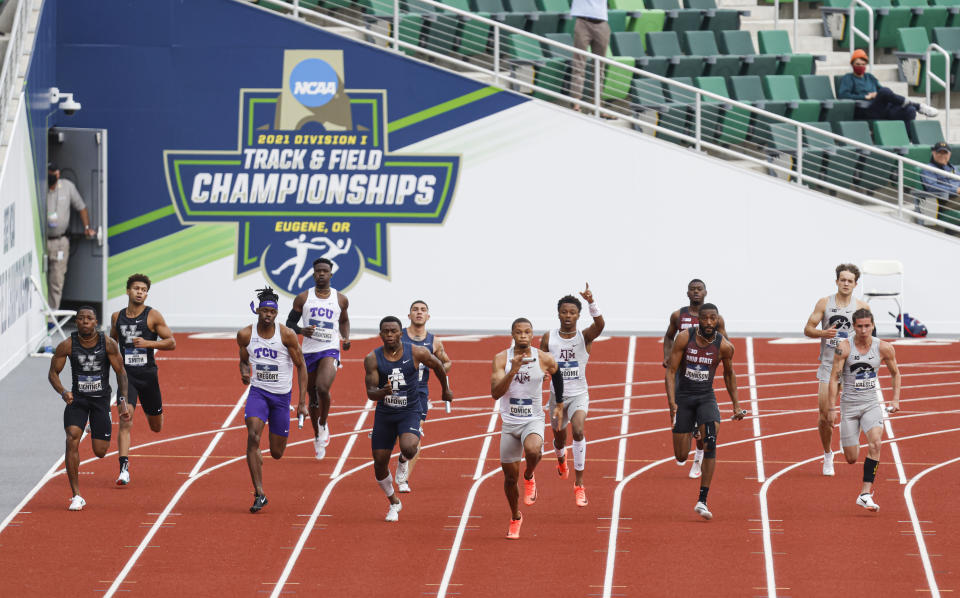 Runners take off on the final leg of the men's 4x100 relay semifinals during theNCAA Division I Outdoor Track and Field Championships, Wednesday, June 9, 2021, at Hayward Field in Eugene, Ore. (AP Photo/Thomas Boyd)