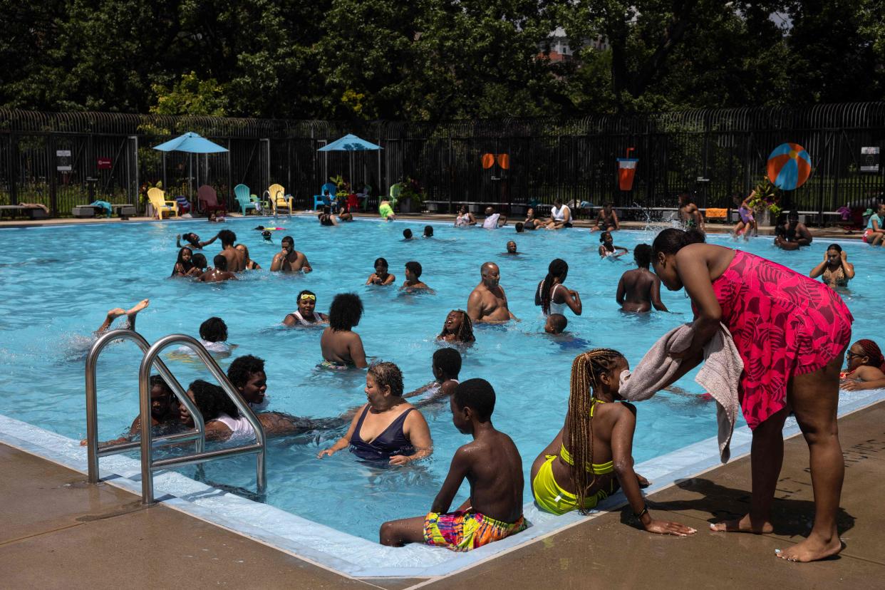 People swim at the Foster Pool in the Bronx borough of New York City on July 28, 2023. July was on track to be the hottest month in recorded history, scientists confirmed on July 27, as UN chief Antonio Guterres warned Earth has moved into an "era of global boiling".