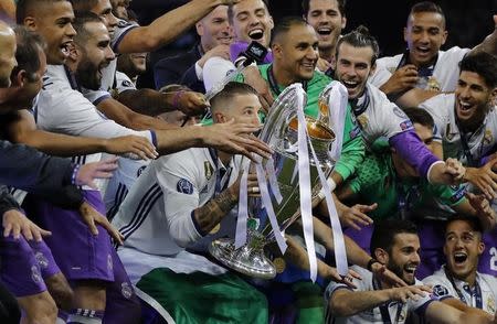 Britain Soccer Football - Juventus v Real Madrid - UEFA Champions League Final - The National Stadium of Wales, Cardiff - June 3, 2017 Real Madrid celebrate with the trophy after winning the UEFA Champions League Final Reuters / Eddie Keogh Livepic