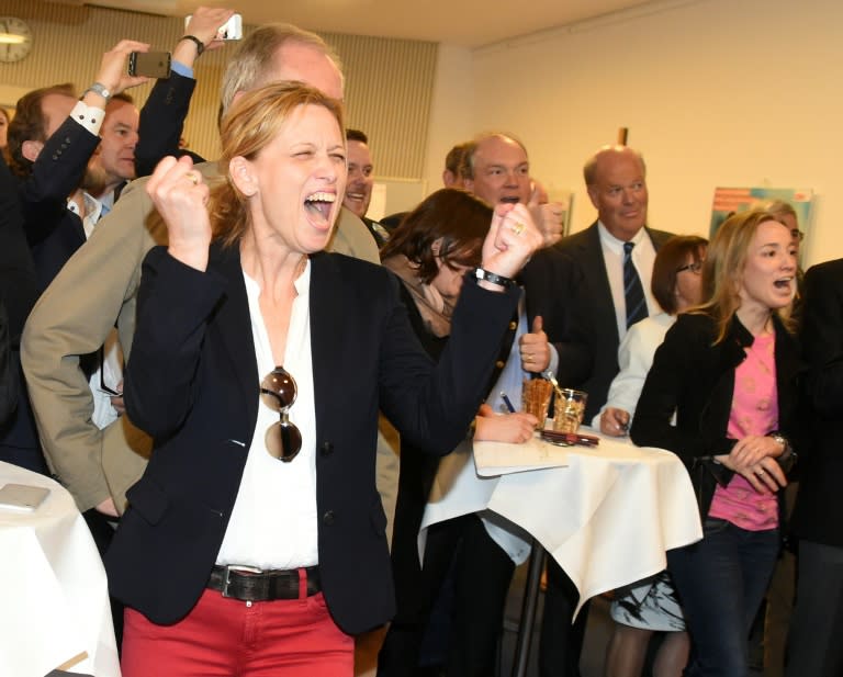 Karin Prien (R) and members of the Conservative Christian Democrats (CDU) party react to election results in Schleswig-Holstein state elections in Kiel, northern Germany, on May 7, 2017