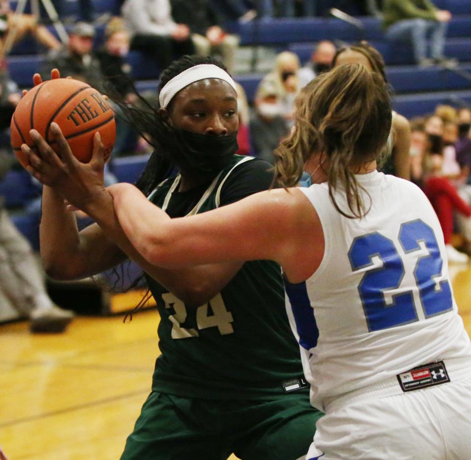 FDR's Nkira Awaka and Millbrook's Ella Wilson battle for the ball during Friday's game on December 3, 2021.