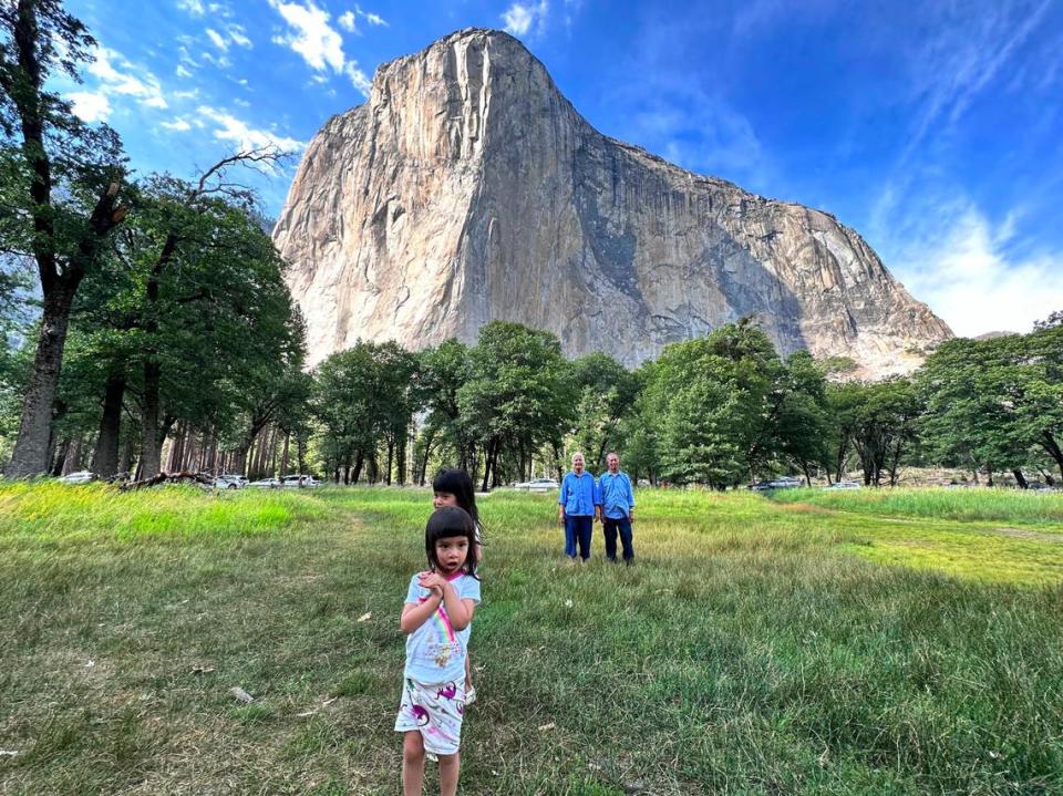 Quang Tran’s 73-year-old parents stand behind Tran’s two daughters. The Aug. 11 trip was his parents’ first time in Yosemite.