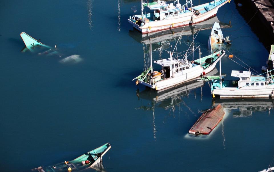 Some fish boats are sunk and overturned after tsunami on January 16, 2022 in Muroto, Kochi, Japan - The Asahi Shimbun