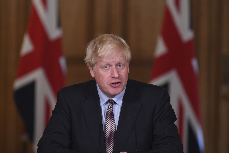 Britain's Prime Minister Boris Johnson speaks during a virtual press conference at Downing Street, London, Wednesday Sept. 9, 2020, following the announcement that the legal limit on social gatherings is set to be reduced from 30 people to six. The change in England will come into force on Monday as the Government seeks to curb the rise in coronavirus cases. (Stefan Rousseau/Pool via AP)